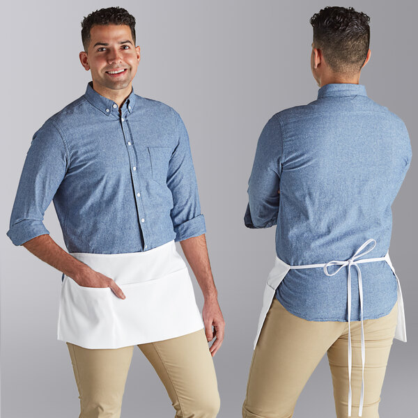 A man wearing a white Choice standard waist apron over a blue shirt.