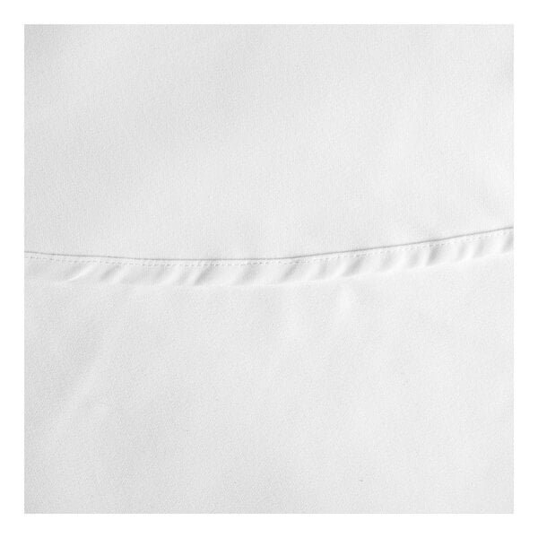 A close up of a white fabric with a small edge.