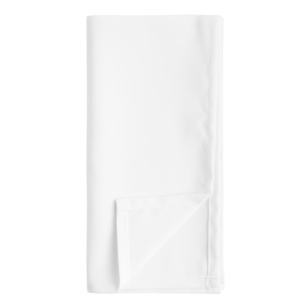 A white cloth napkin folded with a corner tucked in.