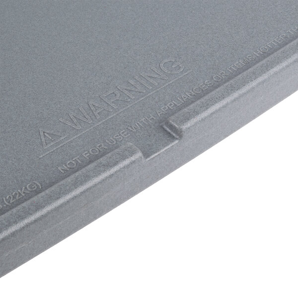 A navy blue Cambro end table for a food bar with a grey box on top.