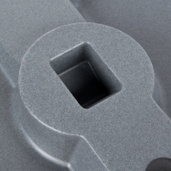 A close up of a navy blue Cambro end table with a square hole in the surface.