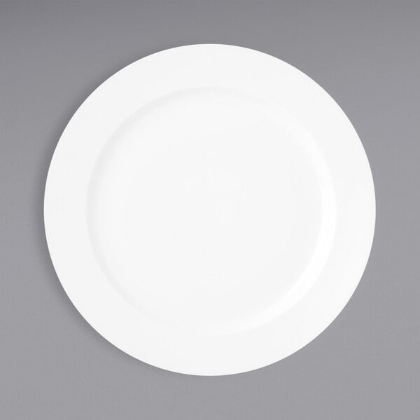 A Oneida Verge warm white porcelain plate on a gray surface.