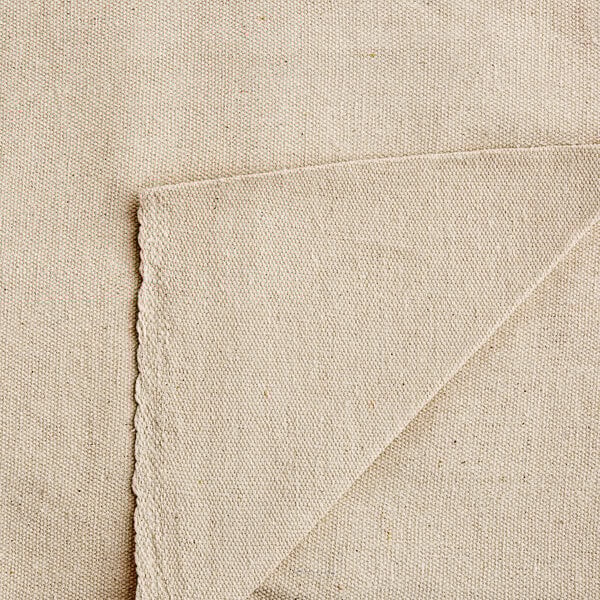 A close up of a beige Monarch Brands canvas drop cloth.