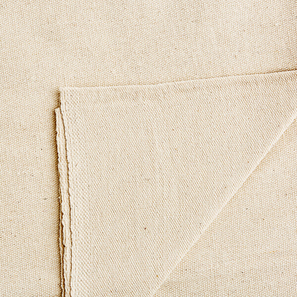 A beige Monarch Brands canvas drop cloth with folded edges.