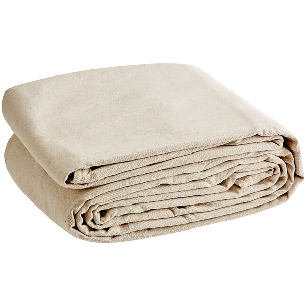 A stack of beige Monarch Brands canvas drop cloths.