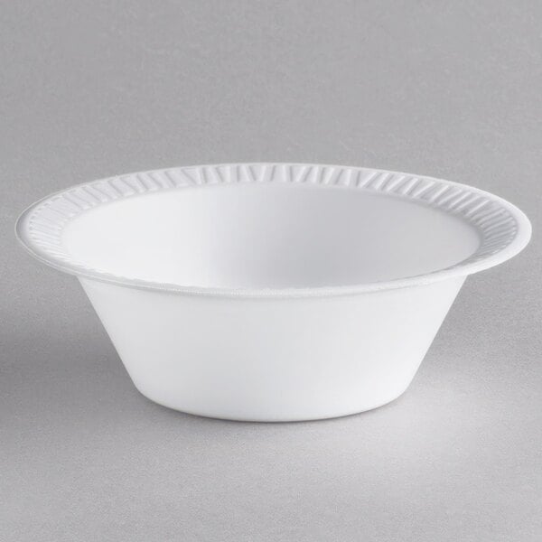 A white Dart foam bowl with a rim.