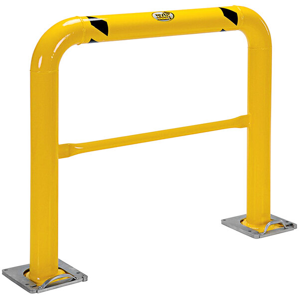 A yellow metal barrier with black and yellow stripes and two black handles.