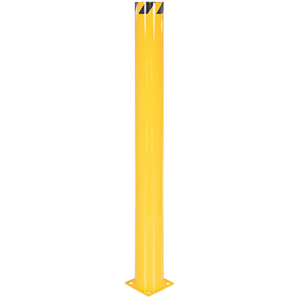 A yellow steel safety bollard with black stripes on it.