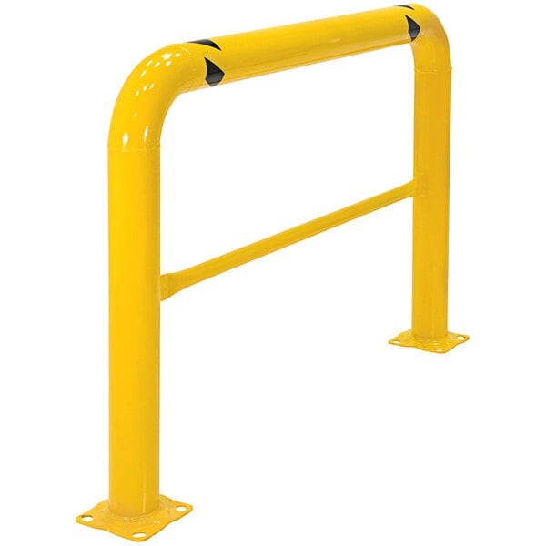 A yellow metal guard rail with black markings and two black handles.