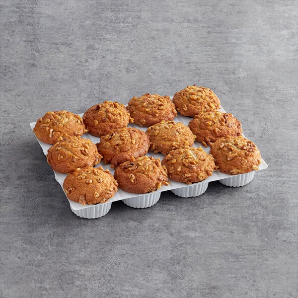 A tray of David's Cookies Banana Nut Muffins on a gray surface.