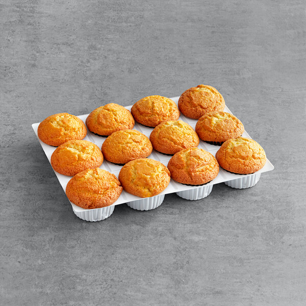 A tray of David's Cookies corn muffins on a gray surface.