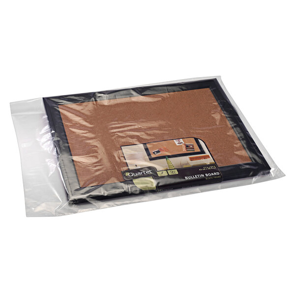 A clear plastic Lavex poly bag holding a cork board.