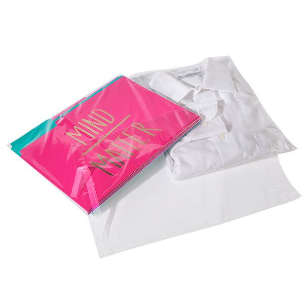 A white shirt in a clear poly bag with a pink resealable closure.