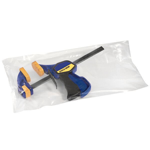 A clear plastic bag with a blue and yellow tool.