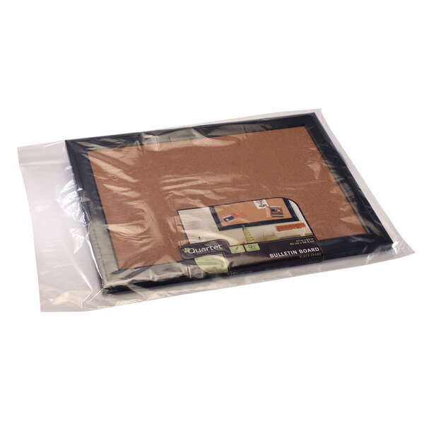 A Lavex clear flat poly bag containing a cork board.