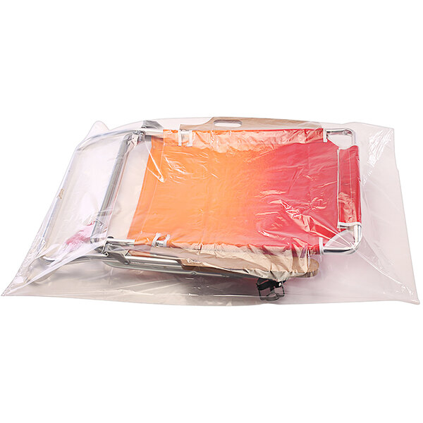 A roll of Lavex clear plastic poly bags with a red and orange chair inside.