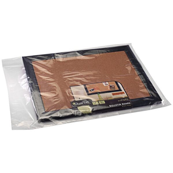 A close up of a package of Lavex clear plastic poly bags on a table with brown and orange food.