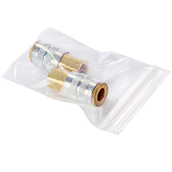 A clear plastic bag with a couple of gold and silver metal connectors.