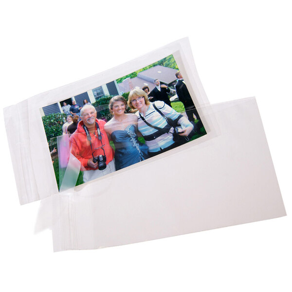 Two white envelopes with a clear poly bag of white envelopes inside.
