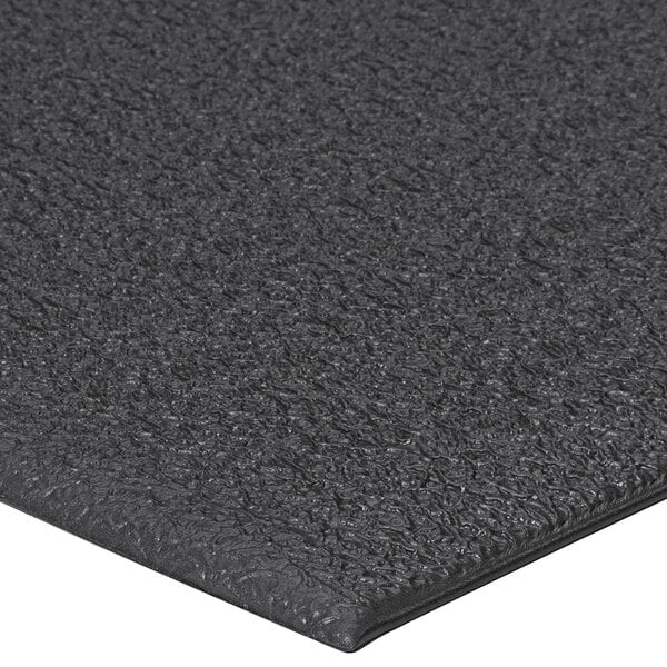 A close up of a black Lavex ArmorStep foam mat with a pebble emboss.
