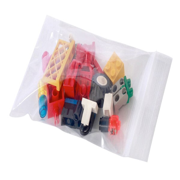 A clear plastic bag full of colorful toy blocks.