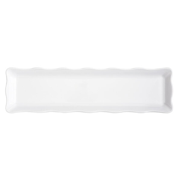 A white rectangular melamine tray with wavy edges and a long handle.