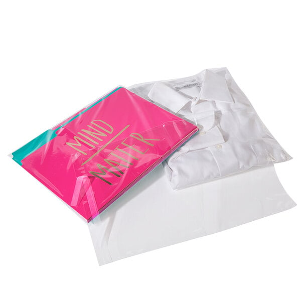 A white shirt in a clear resealable poly bag with a pink label.