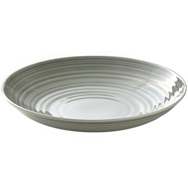 A white porcelain deep coupe plate with a ripples and a gray rim.