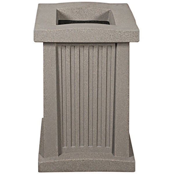 A grey rectangular Wausau Tile cigarette ash receptacle with vertical lines.