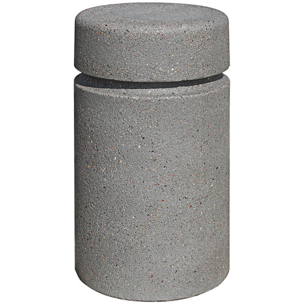 A grey concrete round bollard with a reveal line.