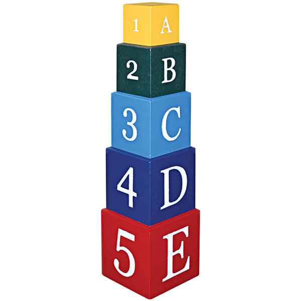 A stack of Wausau Tile concrete blocks with colorful letters on a blue and red block.