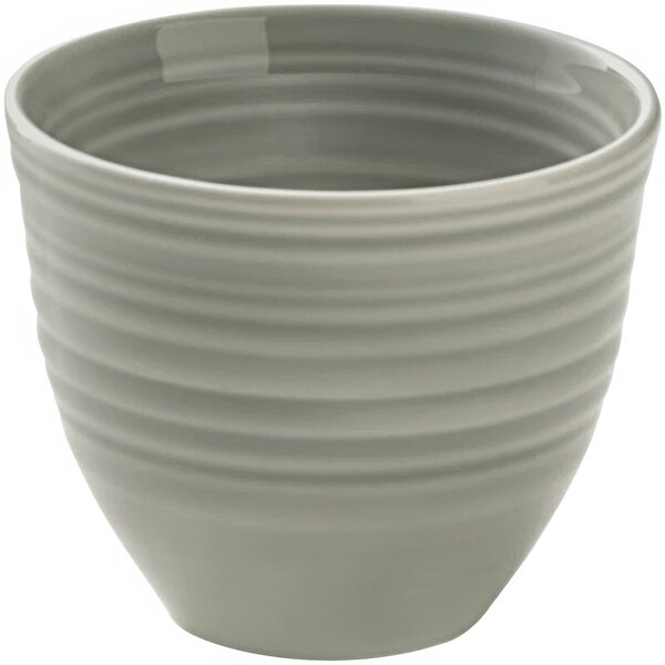 A white porcelain bowl with a curved pattern on it.
