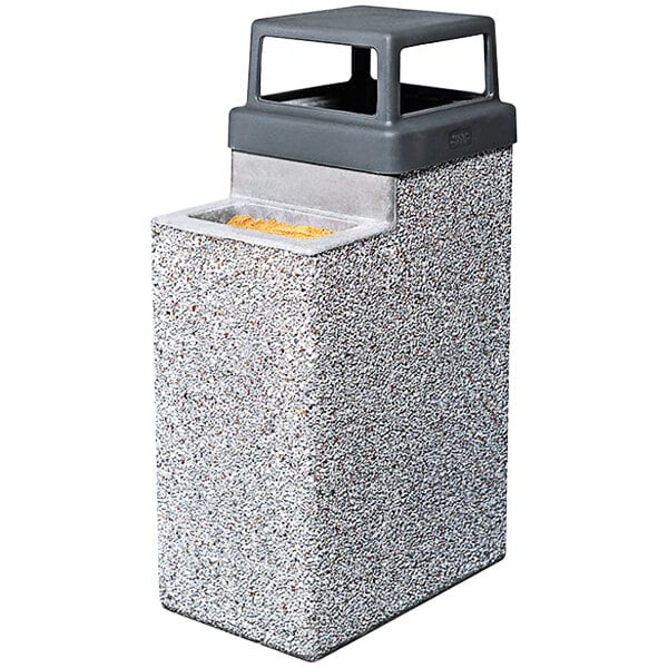 A grey rectangular Wausau Tile 4-way top for a square concrete waste and cigarette ash receptacle.