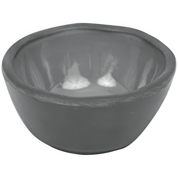 A Dalebrook charcoal gray melamine ramekin with white liquid inside.