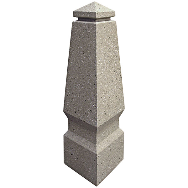 A Wausau Tile Little Canada stone bollard with a pointed top.