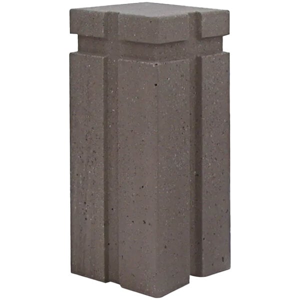 A Wausau Tile concrete bollard with a square top and cross design on it.