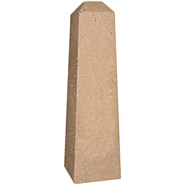 A close-up of a stone pillar with a white background.