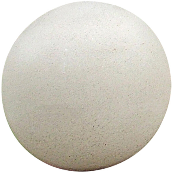 A close-up of a white Wausau Tile concrete sphere bollard with black specks.