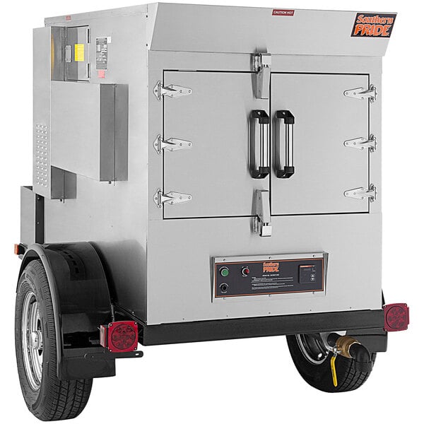 A large silver Southern Pride SPX-300 smoker box on a trailer.