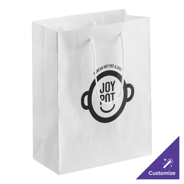 A customizable white paper bag with rope handles with a logo on it.