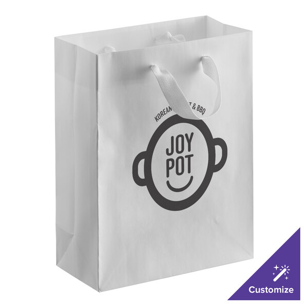 A white customizable paper bag with a logo on it.