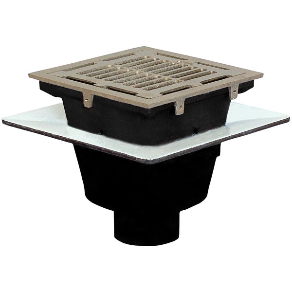A Josam square cast iron floor sink with a nickel bronze grate over a metal drain.
