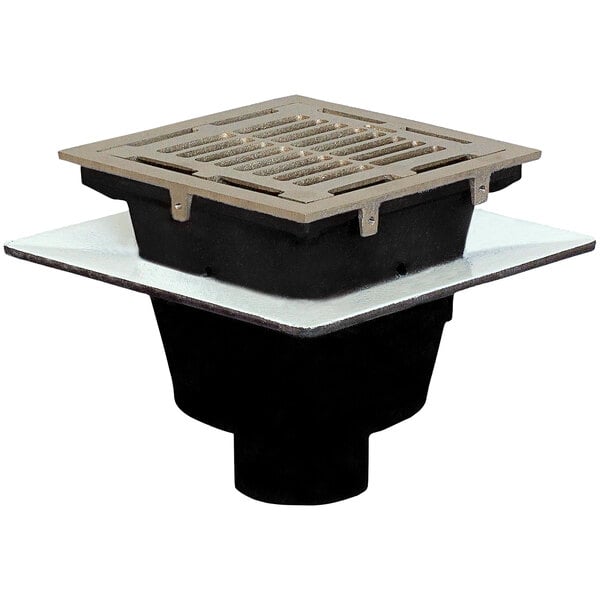 A Josam square cast iron floor sink with a nickel bronze grate over a square drain.