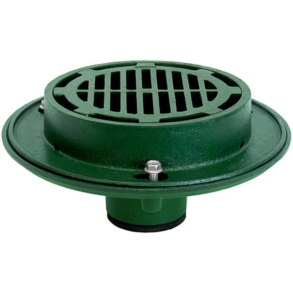 A green metal Josam floor drain with a round base and metal grate.