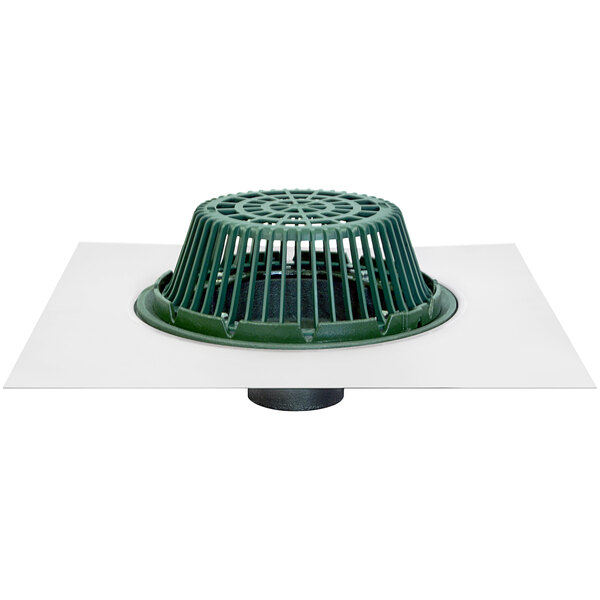 A white square with a green plastic Josam roof drain cover.