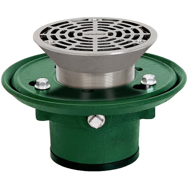 A green and silver circular metal Josam floor drain with a hole and a green Josam strainer.