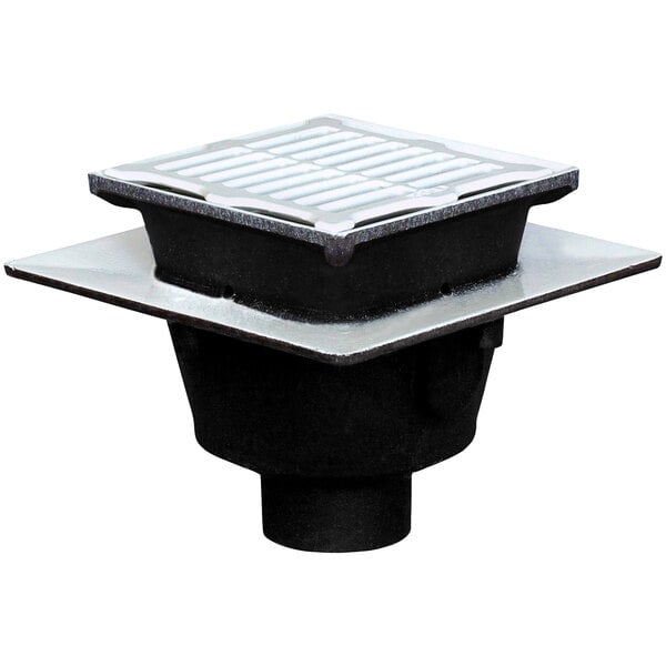 A close-up of a Josam square cast iron floor sink with a black cast iron grate.