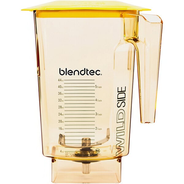 A clear Blendtec blender jar with a yellow handle and lid.