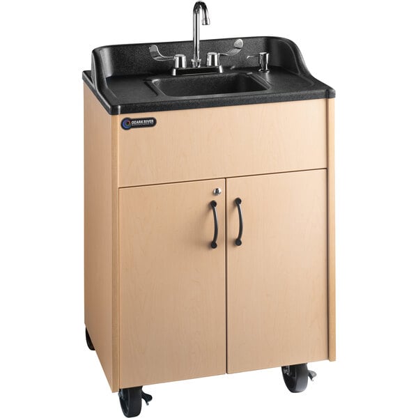 A Premier Maple portable hand sink with a laminate cabinet on wheels.