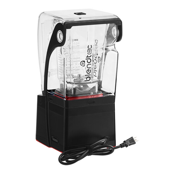 A Blendtec Stealth 885 blender with a clear jar on a counter.